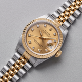 Rolex Lady-Datejust 69173 (1988) - 26 mm, Stahl/Gold, Champagner-Zifferblatt mit Diamanten