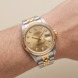 Rolex Lady-Datejust 69173 (1988) - 26 mm, Stahl/Gold, Champagner-Zifferblatt mit Diamanten
